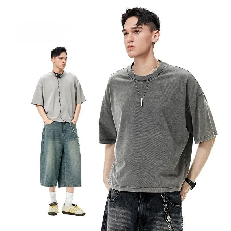 Men's loose vintage washed-out cotton t-shirt in khaki light colour, showing drop-shoulder sleeves and casual fit