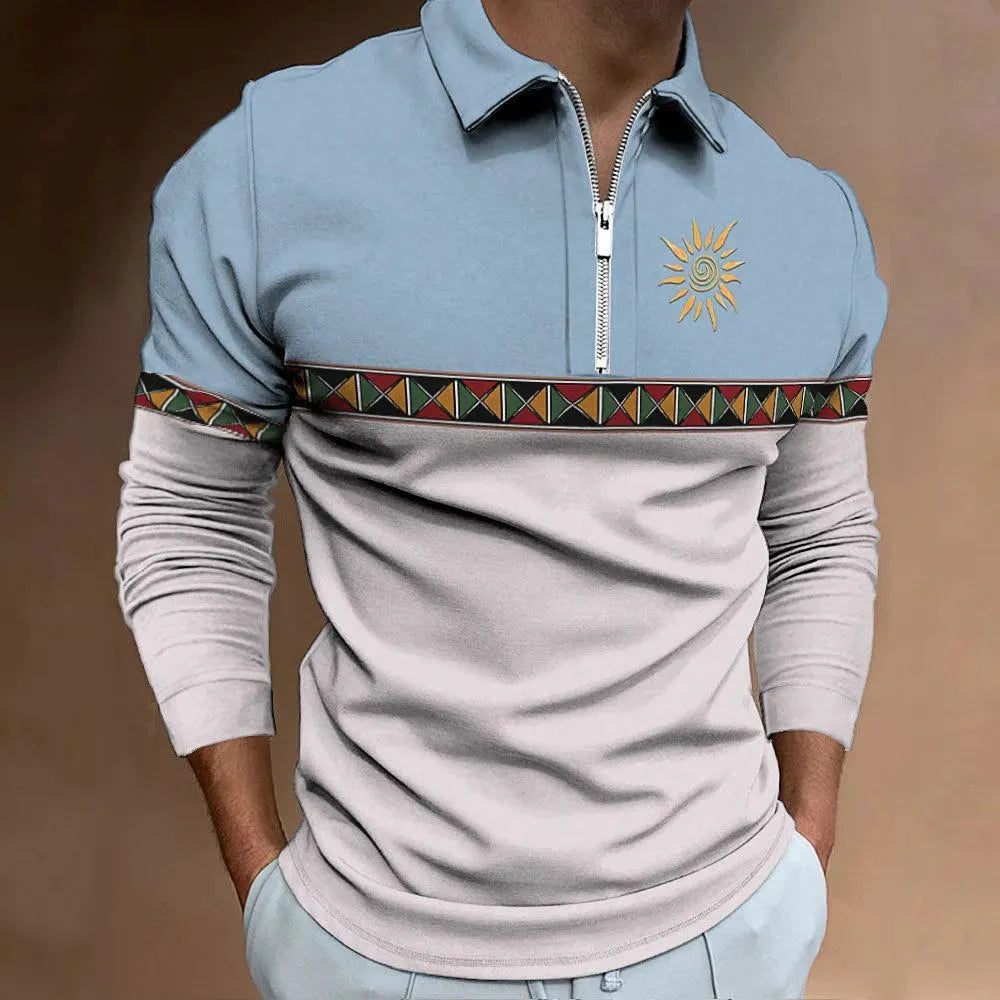 Man wearing a loose-fit, long-sleeve retro printed t-shirt with stripes and zipper decorations.