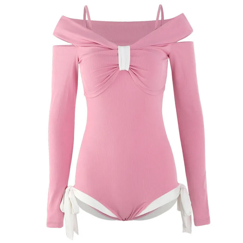 Women's long sleeve one-piece swimsuit in pink or black colours with figure-flattering design