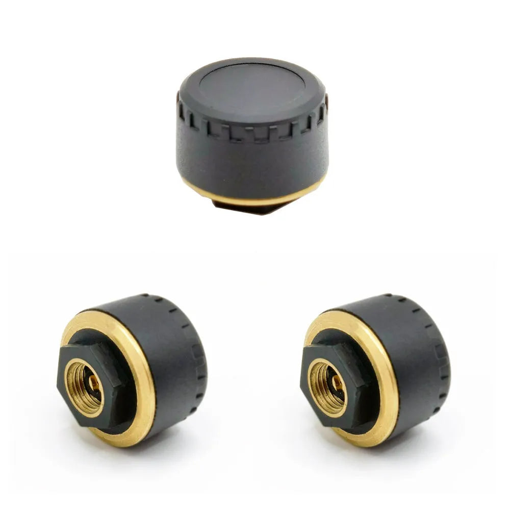 Four black Bluetooth tyre pressure sensors for mobile app monitoring system