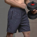 Men's loose fit sports shorts in polyester fabric available in black, grey and blue colours