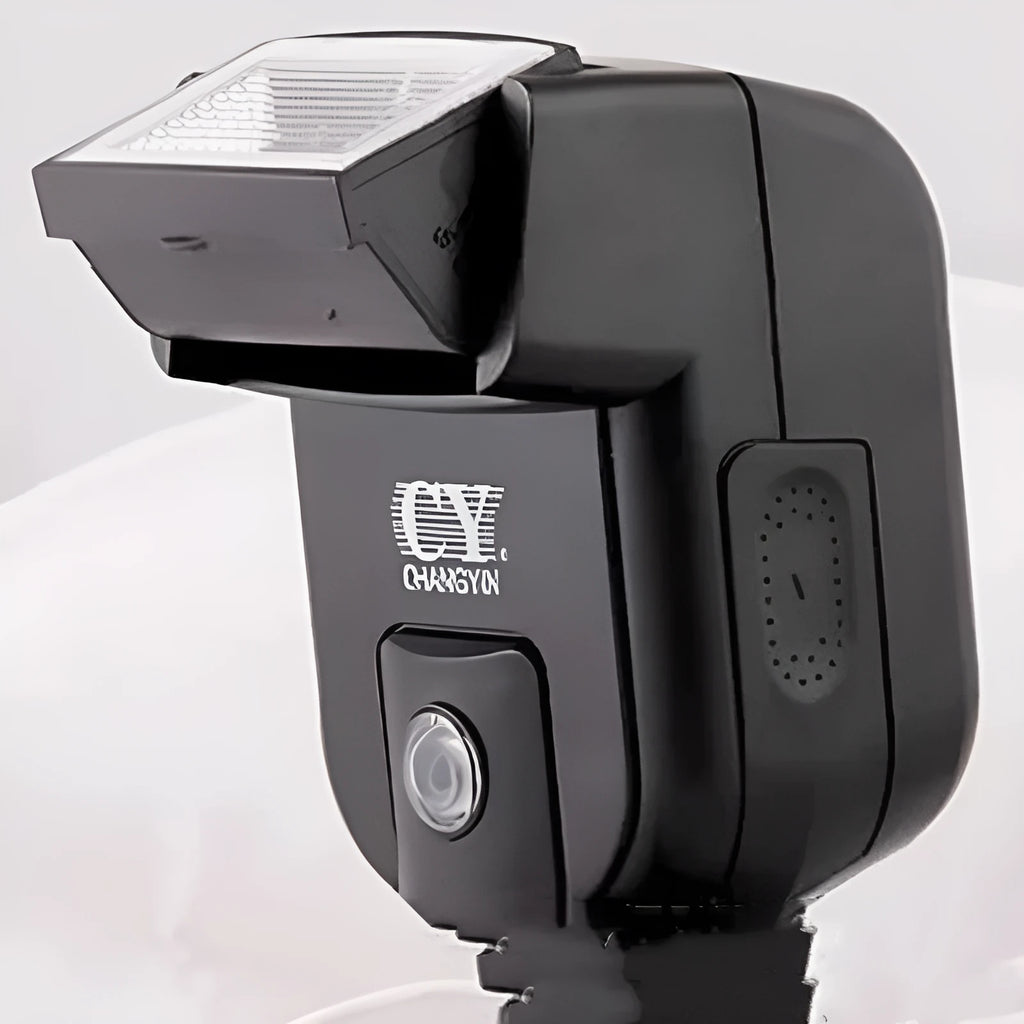 Compact black SLR camera flash unit shown tilted upwards on a hotshoe, illustrating its 90-degree bounce flash capability.