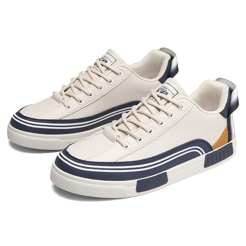 Men's white and green canvas casual shoes with mesh panels and a flat heel.