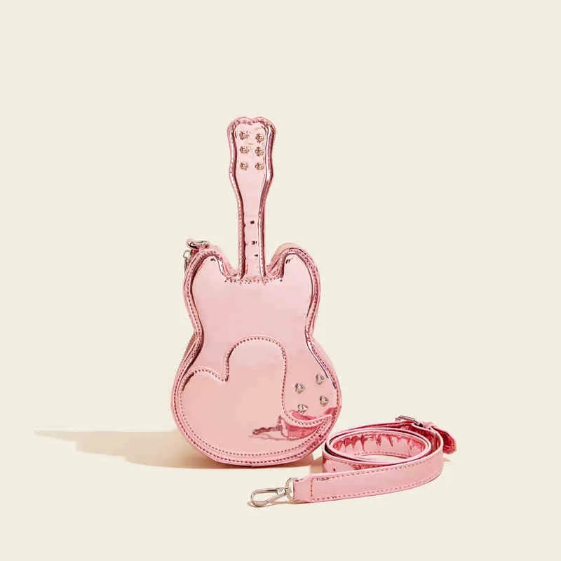 Guitar-shaped silver crossbody shoulder bag showing front pocket and adjustable strap