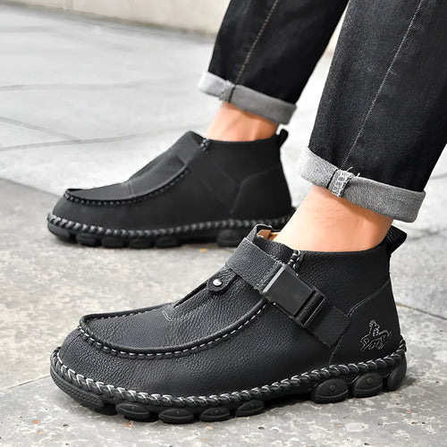 Black synthetic leather slip-on flat shoes with handmade stitching on the sole