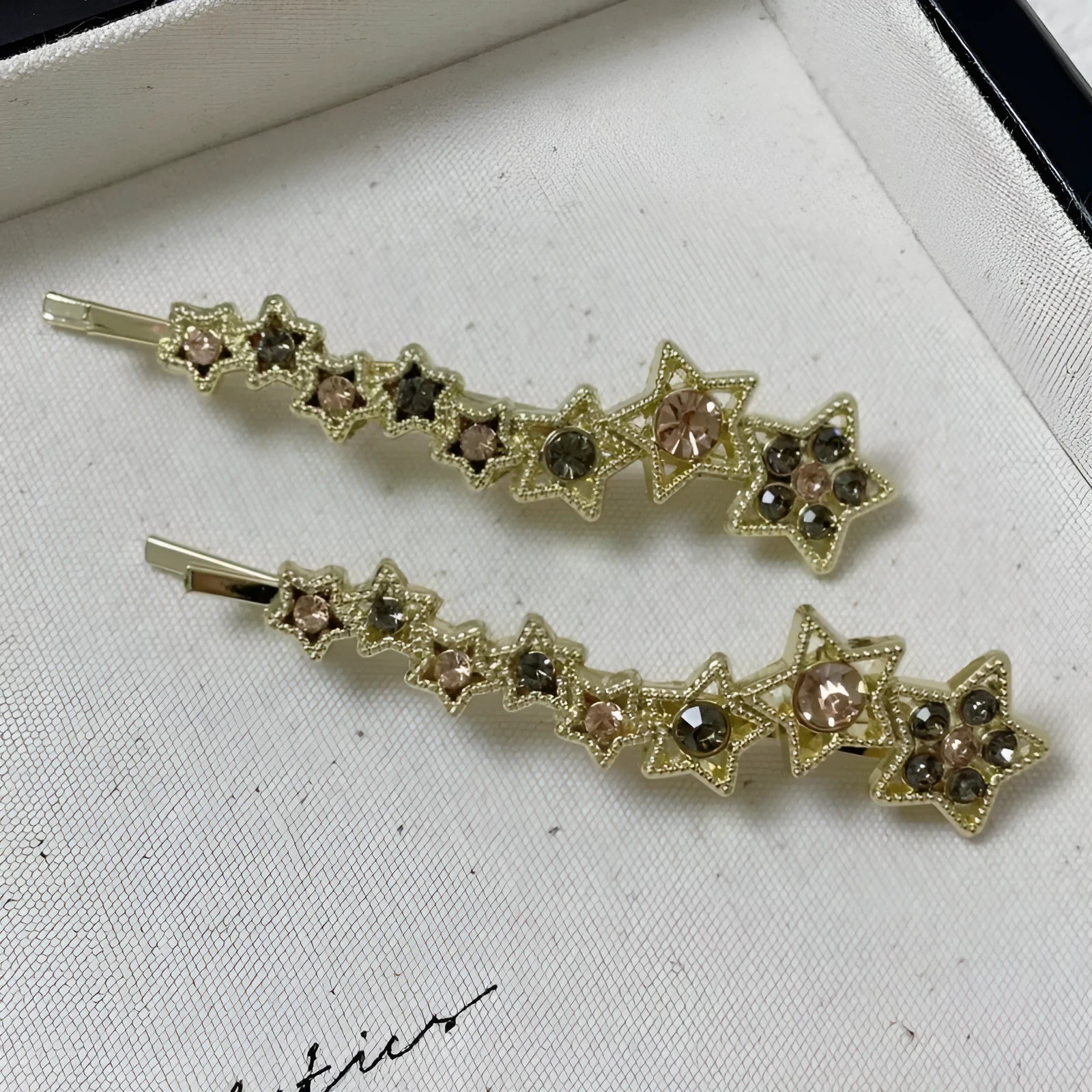 Gold rhinestone barrette with star design for clipping bangs and side hair