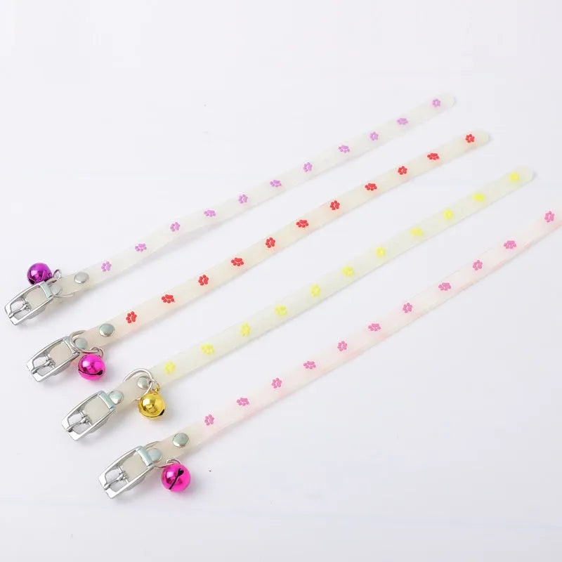 Glow in the dark cat collar with adjustable silicone chain and metal bell in paw print design