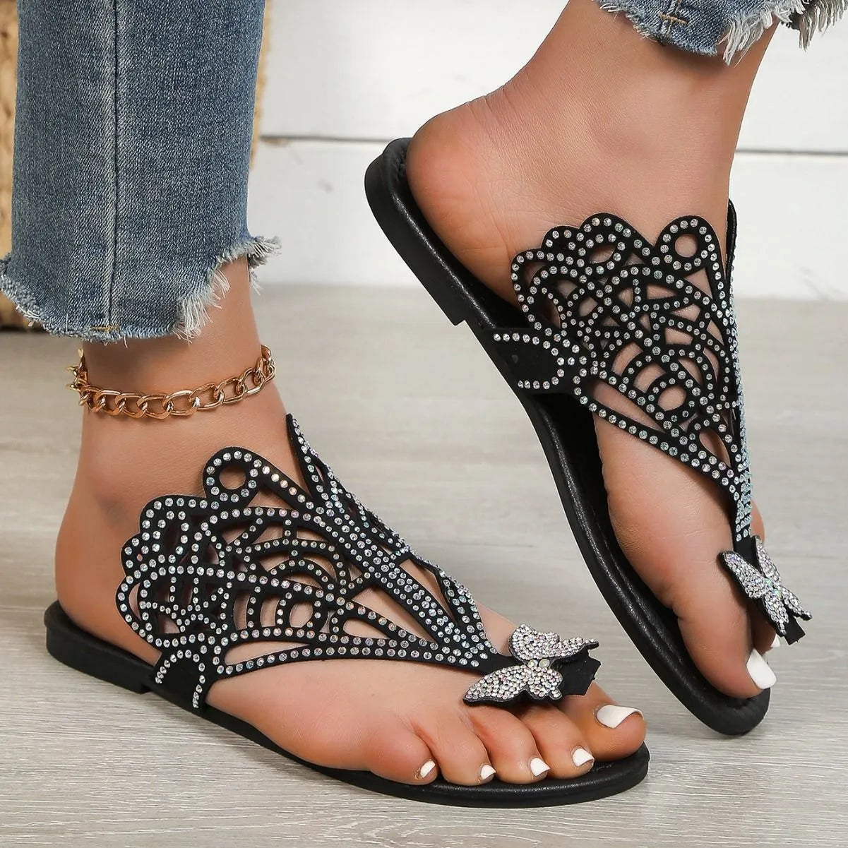 Women's black rhinestone flip-toe slip-on sandals with hollow design and flat rubber sole