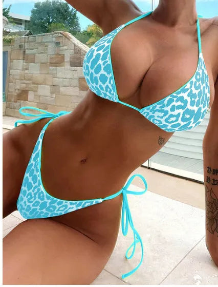 Women's lace-up front triangle bikini and split bottom in a colour style, laid flat.