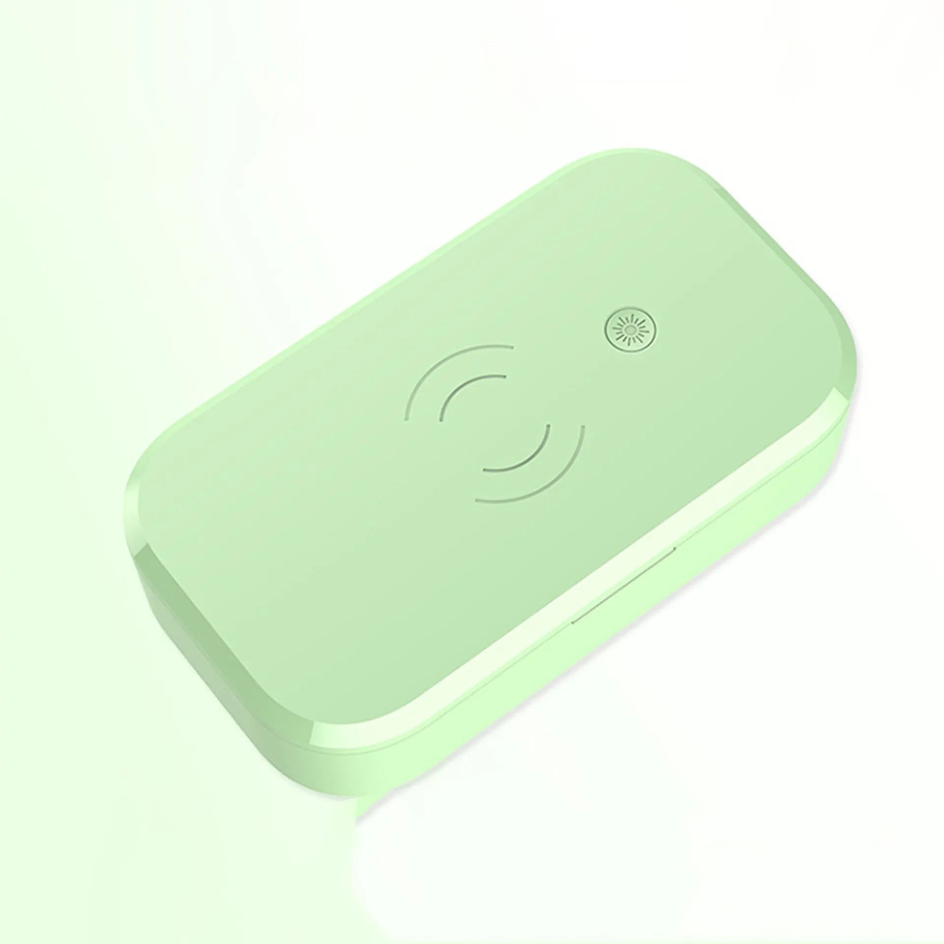 White ultraviolet disinfection box for nail tools with built-in wireless phone charging pad.