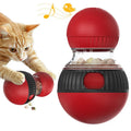 Rotating plastic cat toy ball with food compartment and sound mechanism for indoor pet play