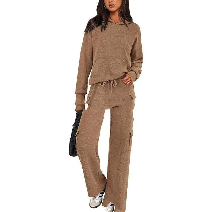 Women's two-piece polyester leisure suit in a solid colour, showing long sleeves and full-length trousers.
