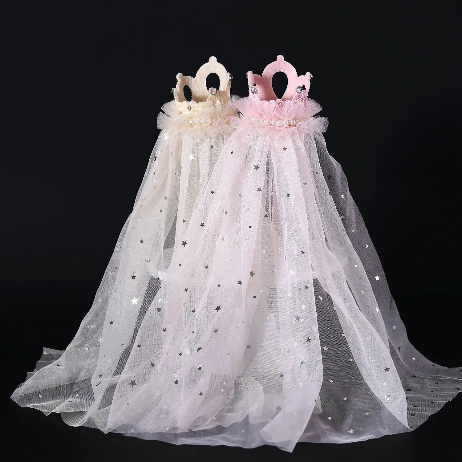 Pet cat wearing a princess crown headdress with a soft pink veil on a fabric headband.