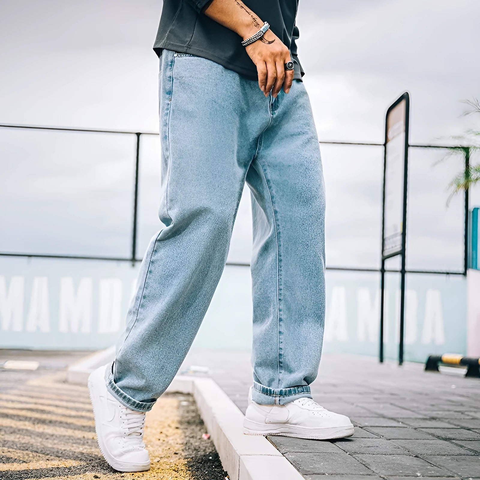 Men's loose straight cotton jeans in dark blue, light blue, and grey colours with mid-rise waist