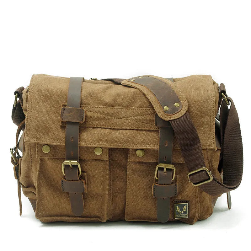 Men's brown retro canvas crossbody shoulder bag with cowhide trim, shown with flap open revealing internal zip pockets.