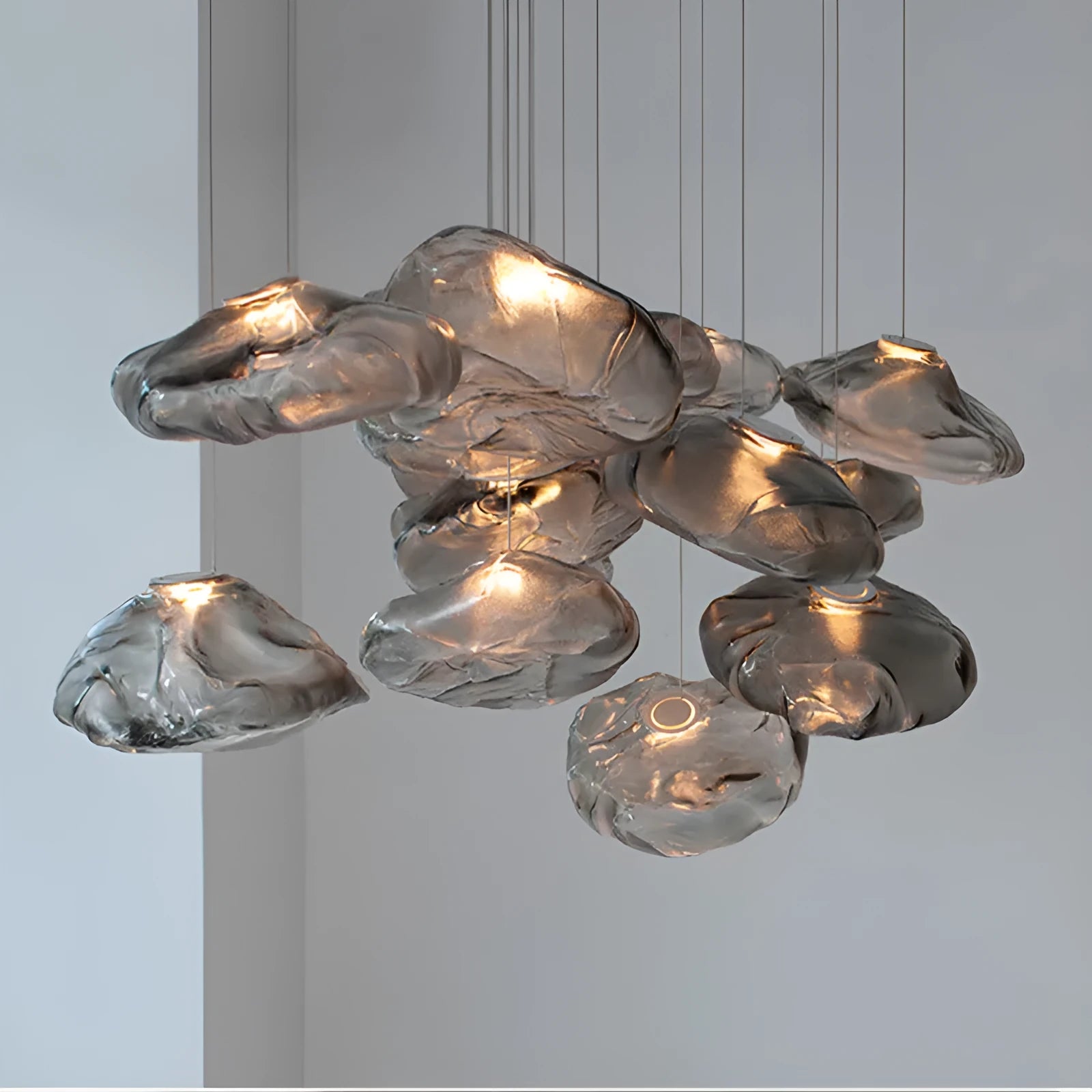 Modern glass and fabric chandelier light fixture in amber, clear or smoke grey.
