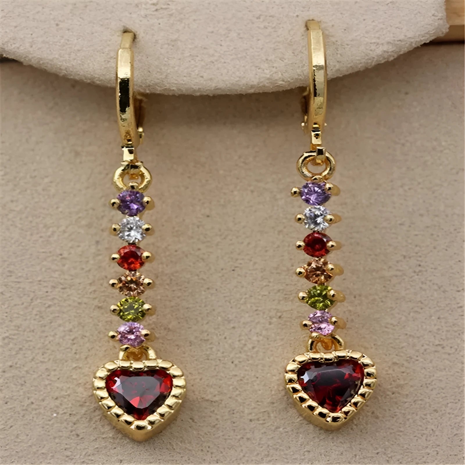Women's heart-shaped alloy earrings with a shiny electroplated finish in gold and silver colours.