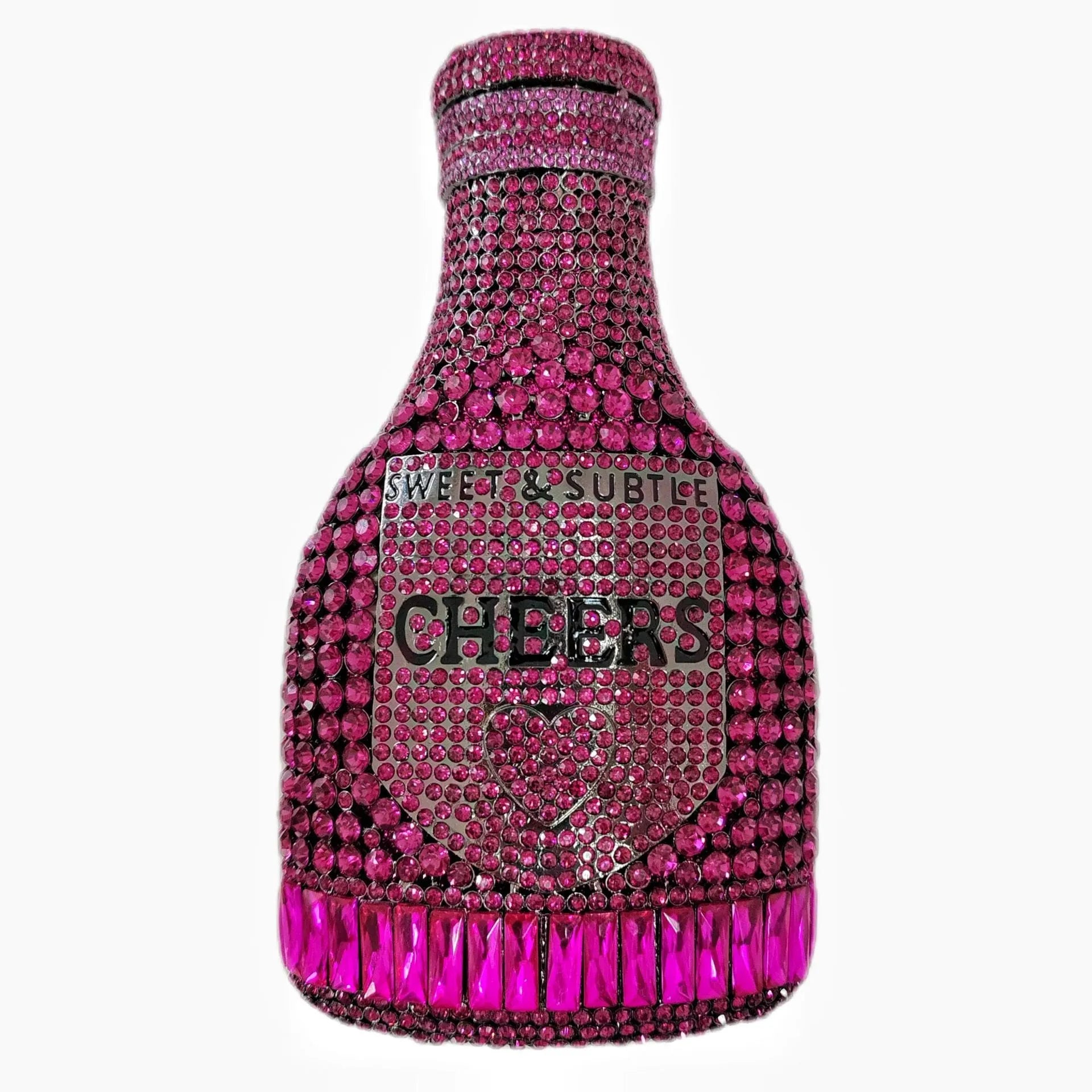 Gold hard-shell champagne bottle shaped evening clutch with rhinestones on a table.