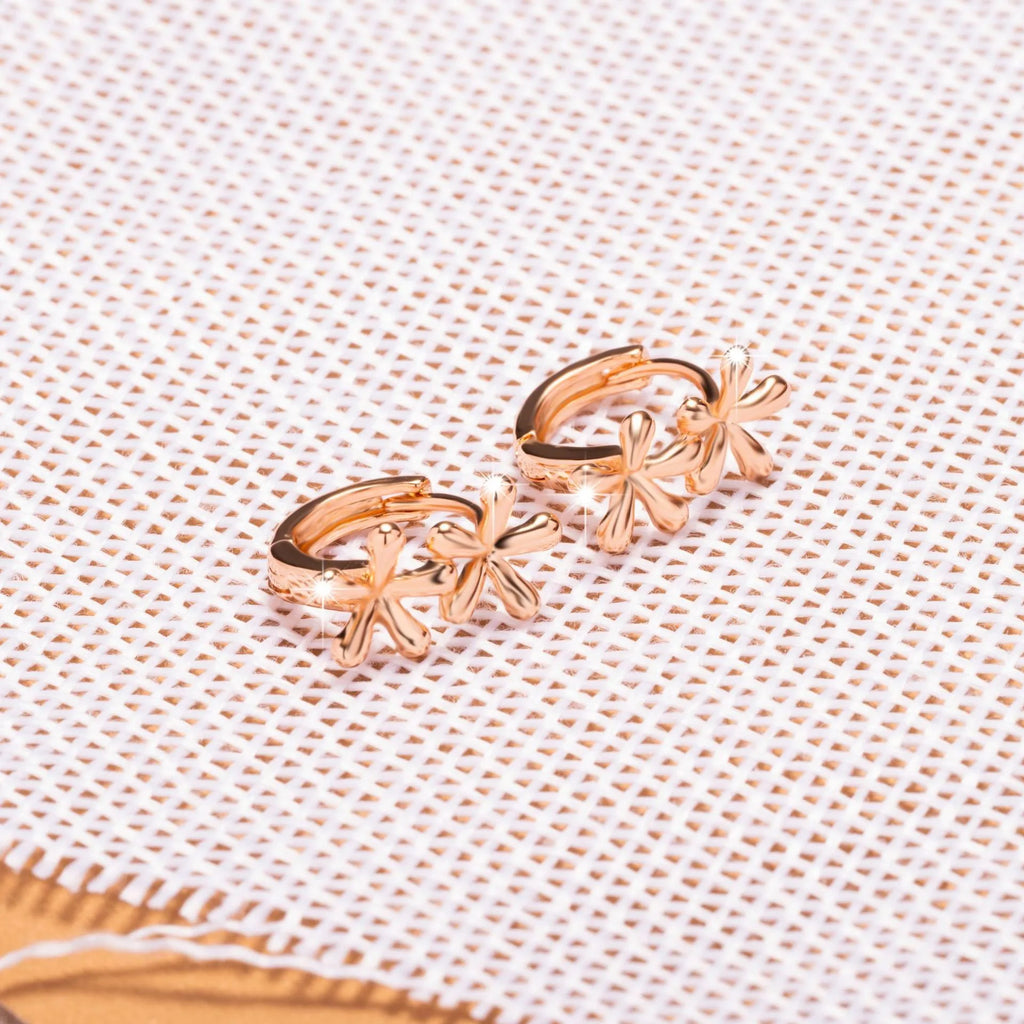 Circular rose gold electroplated earrings with a waterdrop floral design