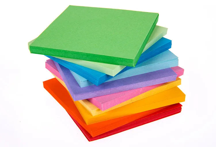 Colourful assortment of small paper scrolls with metal eyelets for drift bottle messages.