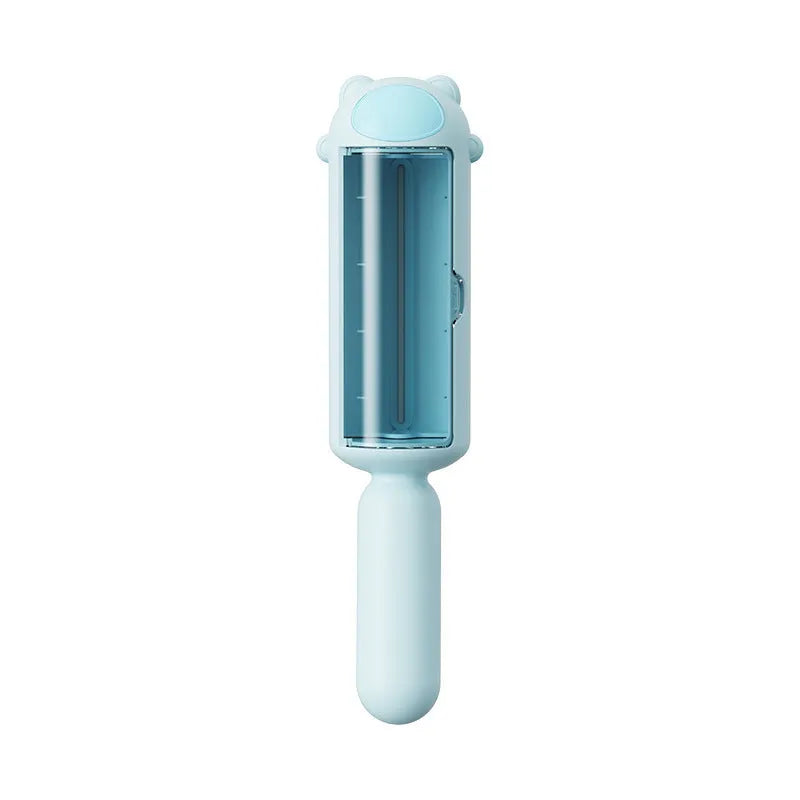 Blue reusable pet hair remover roller for furniture and car seats on a grey sofa