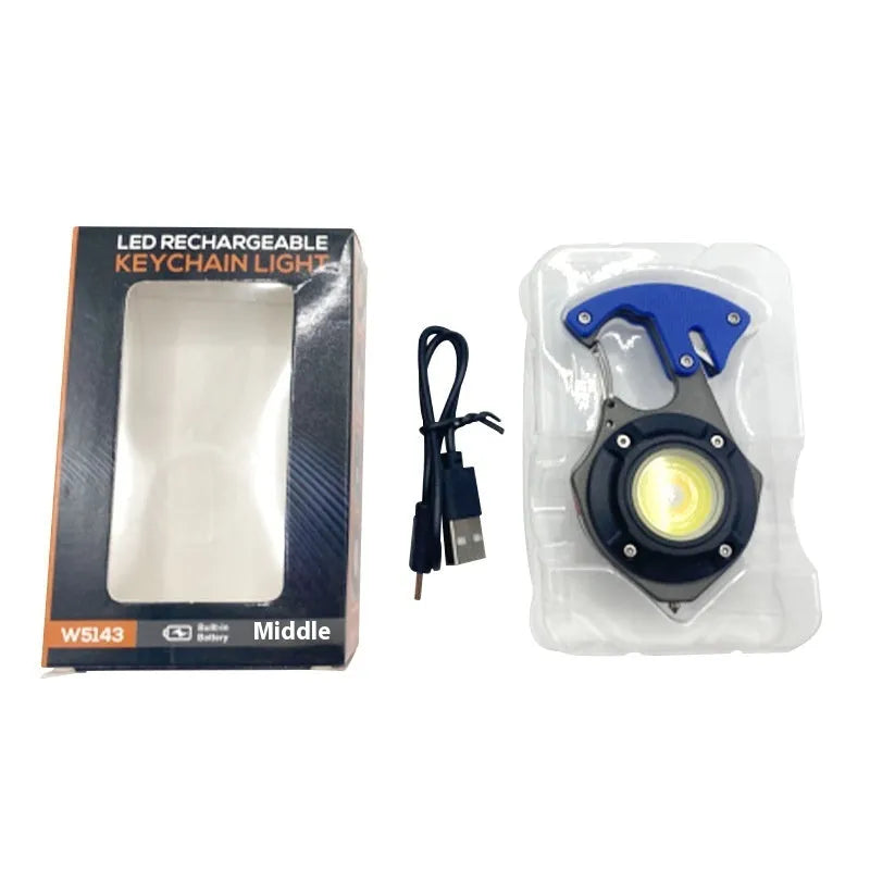 Compact silver and black multifunctional keychain flashlight with keyring, display screen, and integrated window breaker tool.