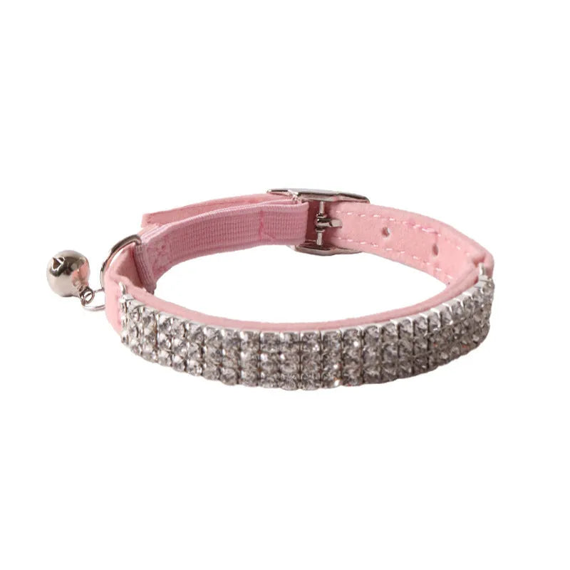Colourful flocking fabric cat collar with elastic buckle shown in pink, black, and blue options