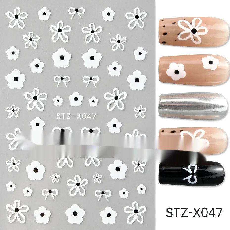 Sheet of black and silver stripe nail art stickers from a cartoon series for DIY manicures.