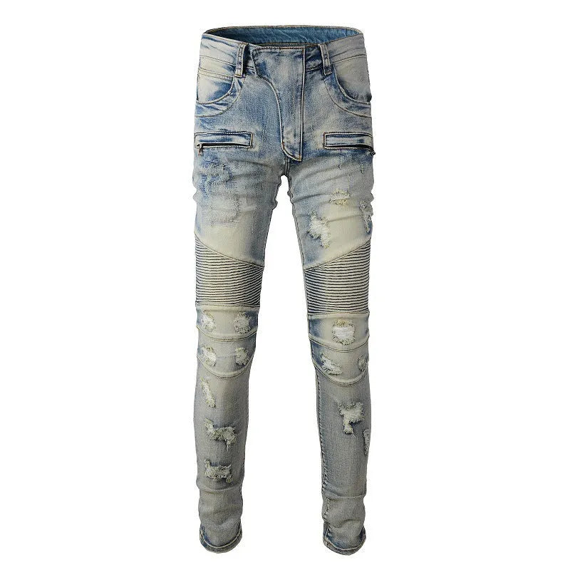 Men's light blue slim fit distressed jeans with hand-frayed details on a mid-waist, straight leg cut.