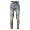 Men's light blue slim fit distressed jeans with hand-frayed details on a mid-waist, straight leg cut.