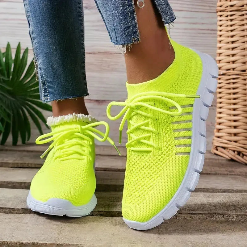 Women's breathable mesh flying knit flat shoes with round toe and low heel design