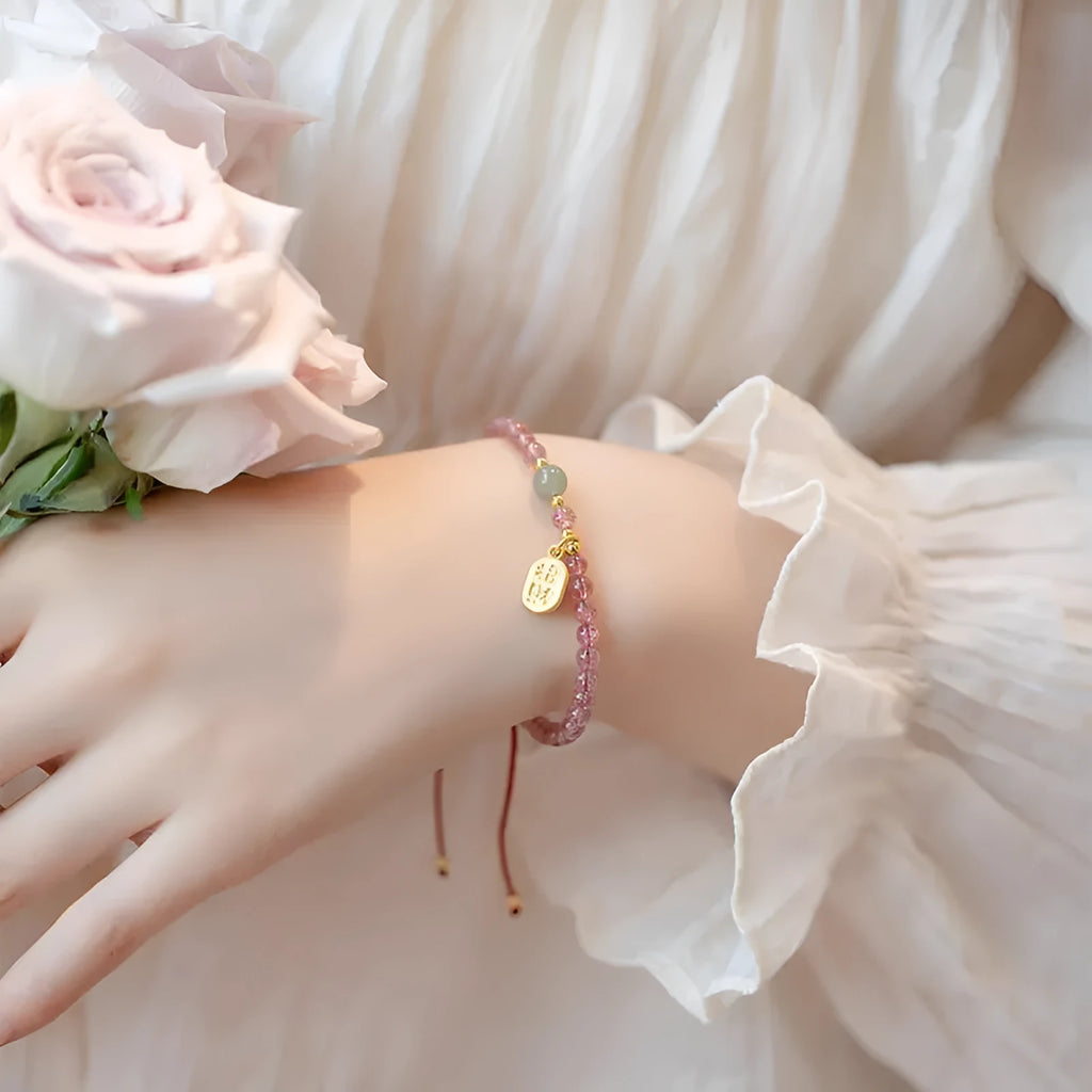 Red rope hand-woven bracelet with crystal centrepiece and adjustable wristband