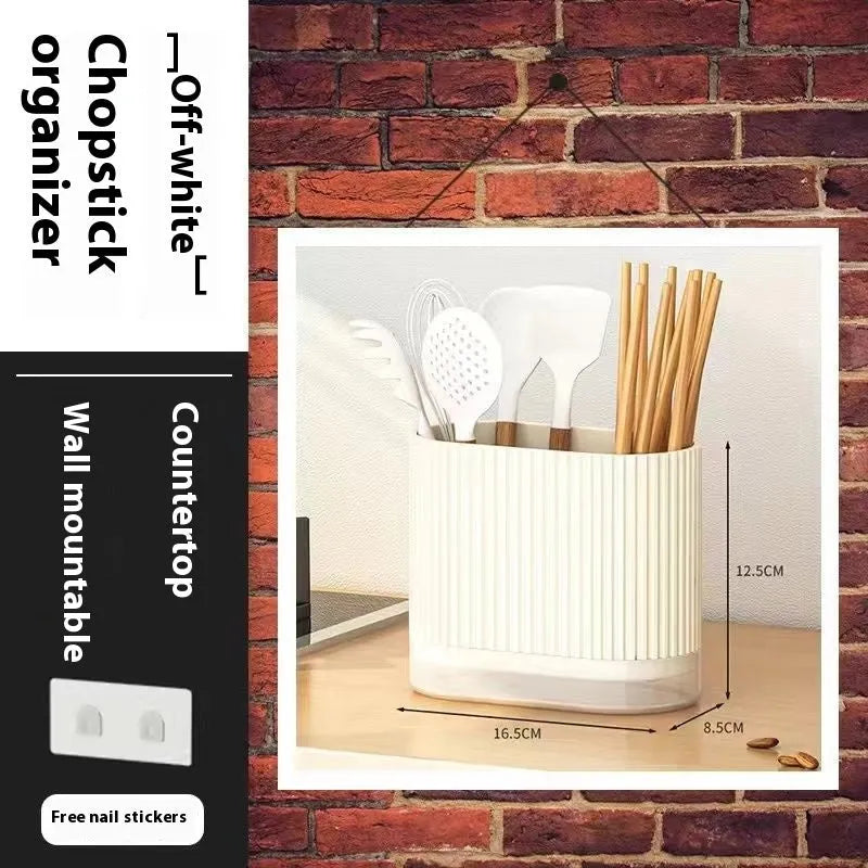 Plastic wall-mounted chopsticks tube and spoon basket organiser in beige, dark green, or orange.