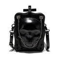 Black mini square crossbody bag with embossed skull design, decorative stitching, rivets, and chain details.