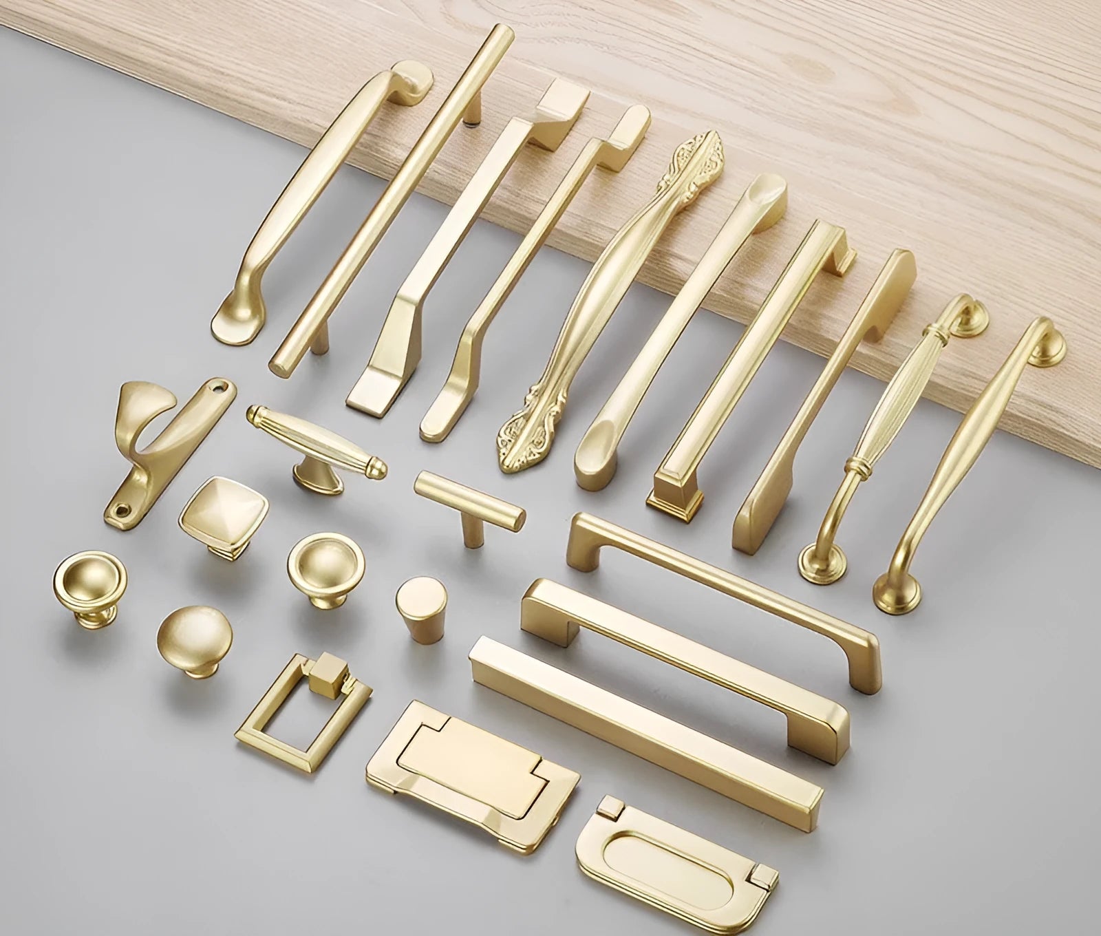 Modern gold aluminium alloy single-hole cabinet handle with T-shape design.