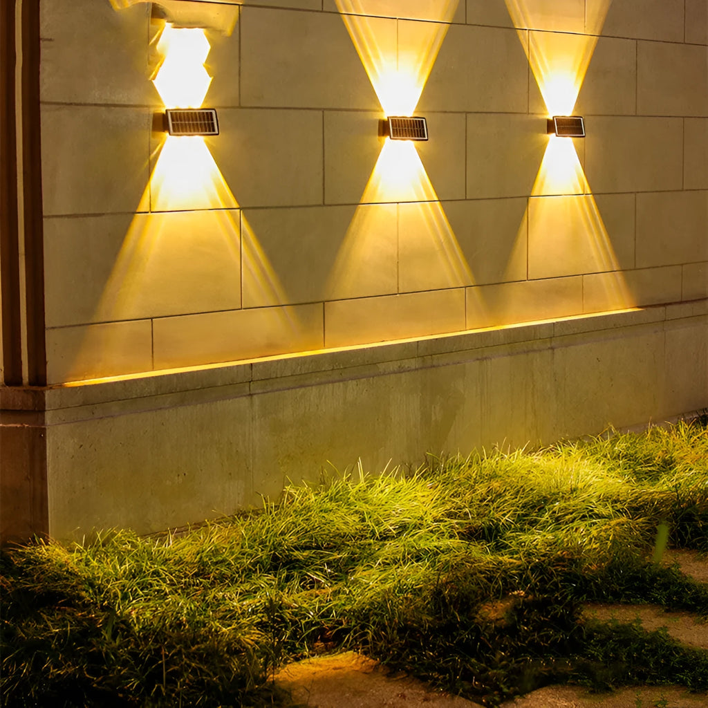 Solar outdoor wall light with 4 LED beads, ABS+PC housing, and glass polysilicon solar panel mounted on a brick wall