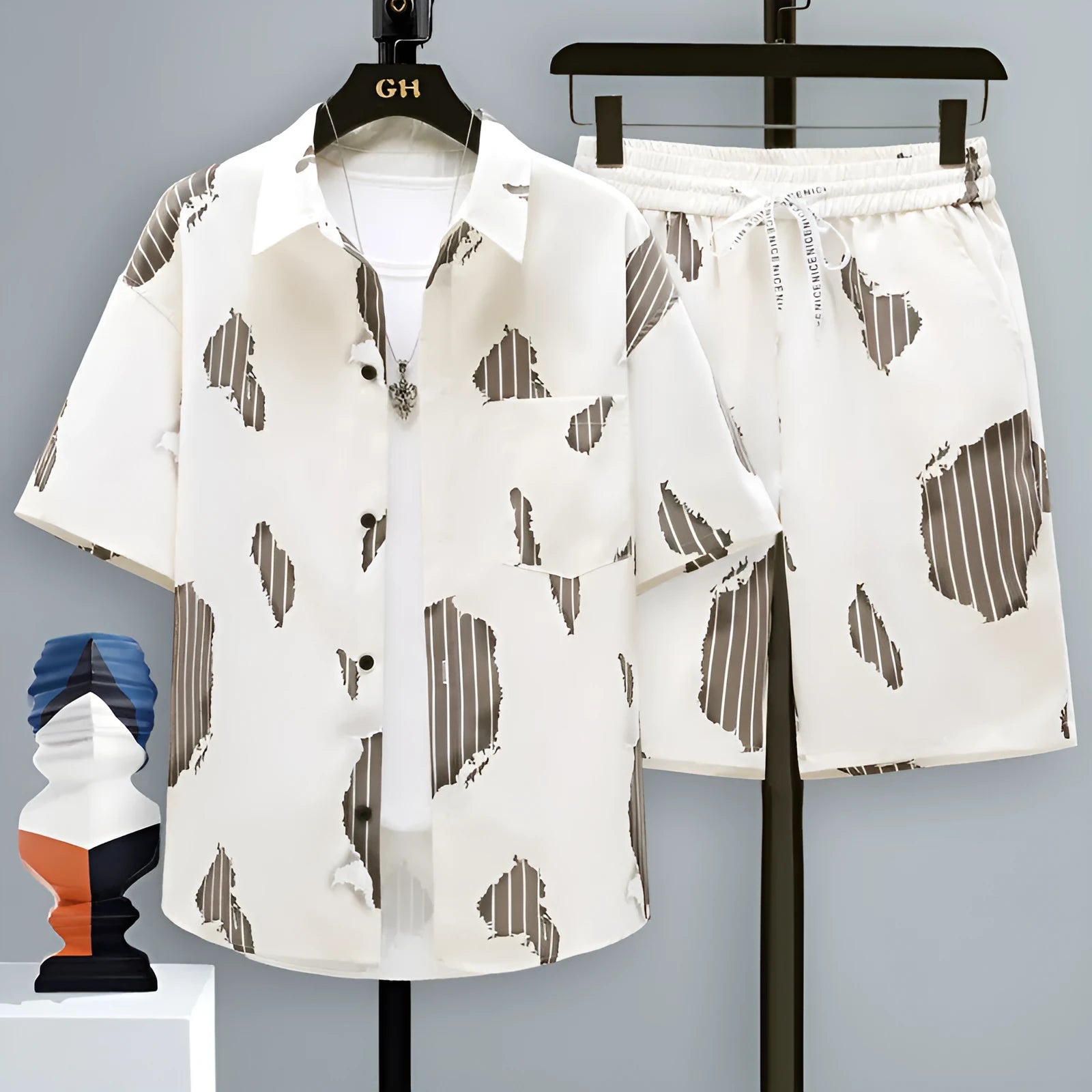 Men's grey casual polyester short-sleeve top and shorts two-piece set laid flat.