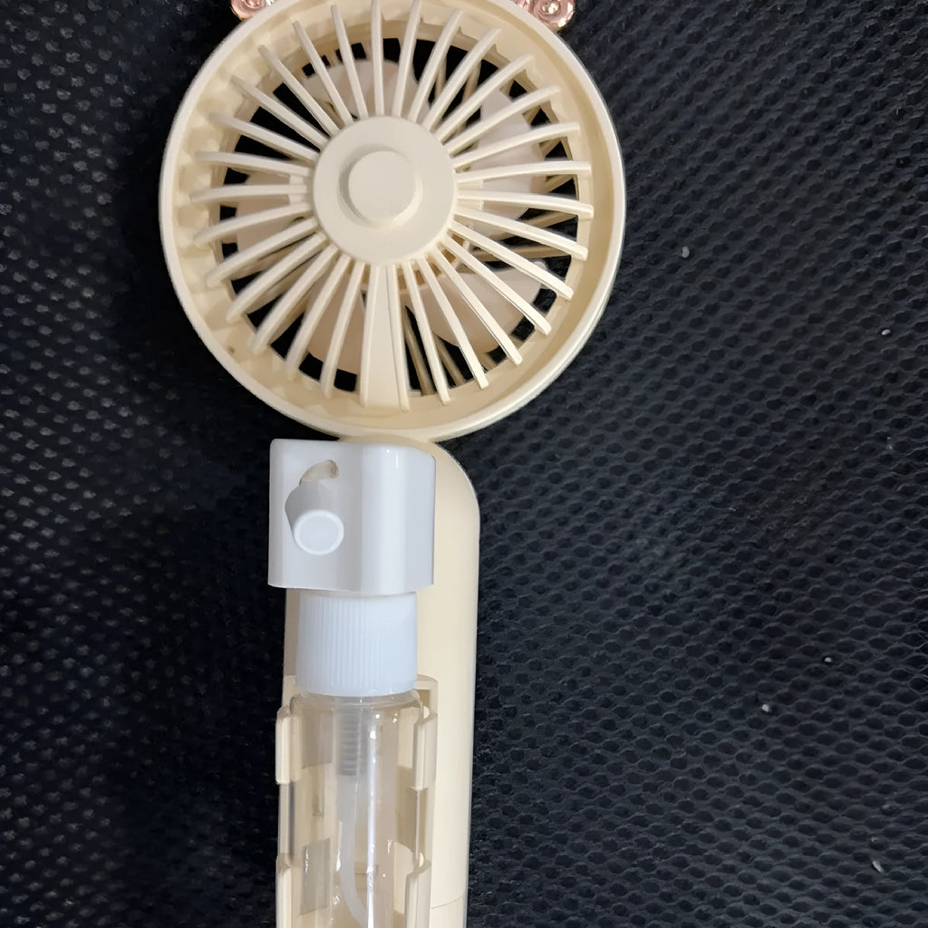 Personalised plastic USB desktop fan in choice of colours on a desk