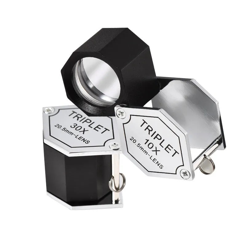 Handheld portable magnifying glass with metal body for jewellery and coin inspection