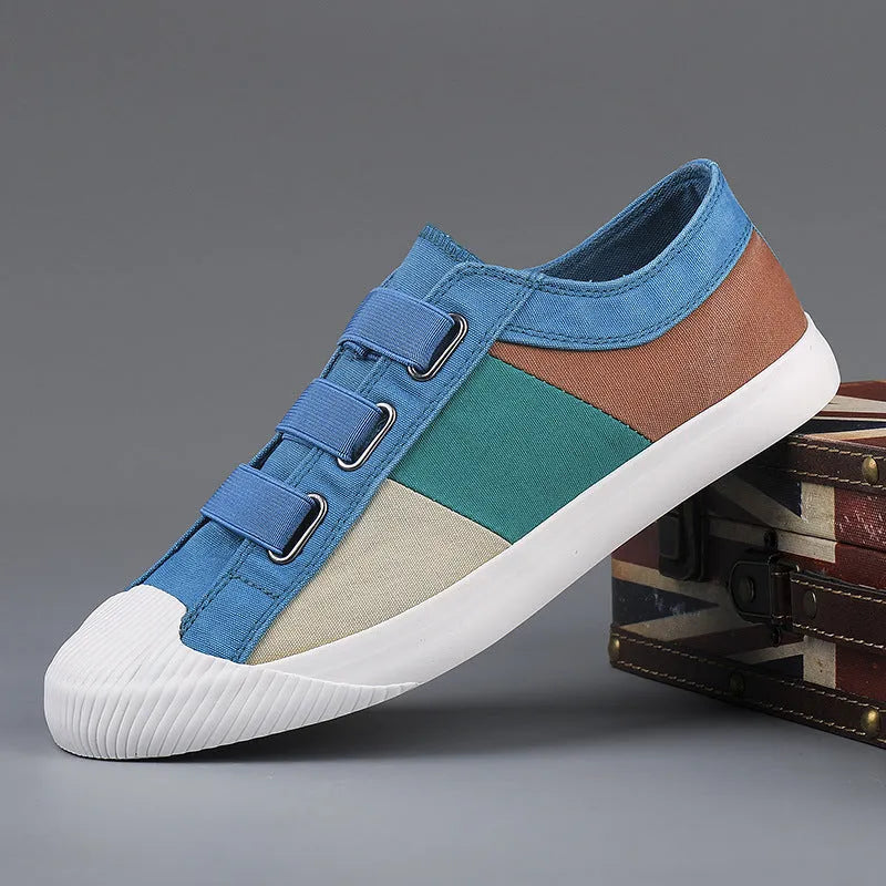 Men's beige canvas low-top sneakers with elastic band closure and a flat rubber sole