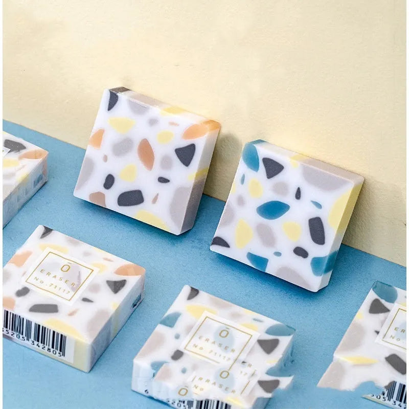White brick-shaped rubber eraser for pencil marks with Super Clean Traceless branding
