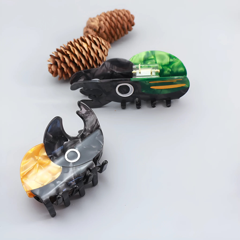 Handmade cellulose acetate hair clip with cartoon beetle design in green or orange colour options