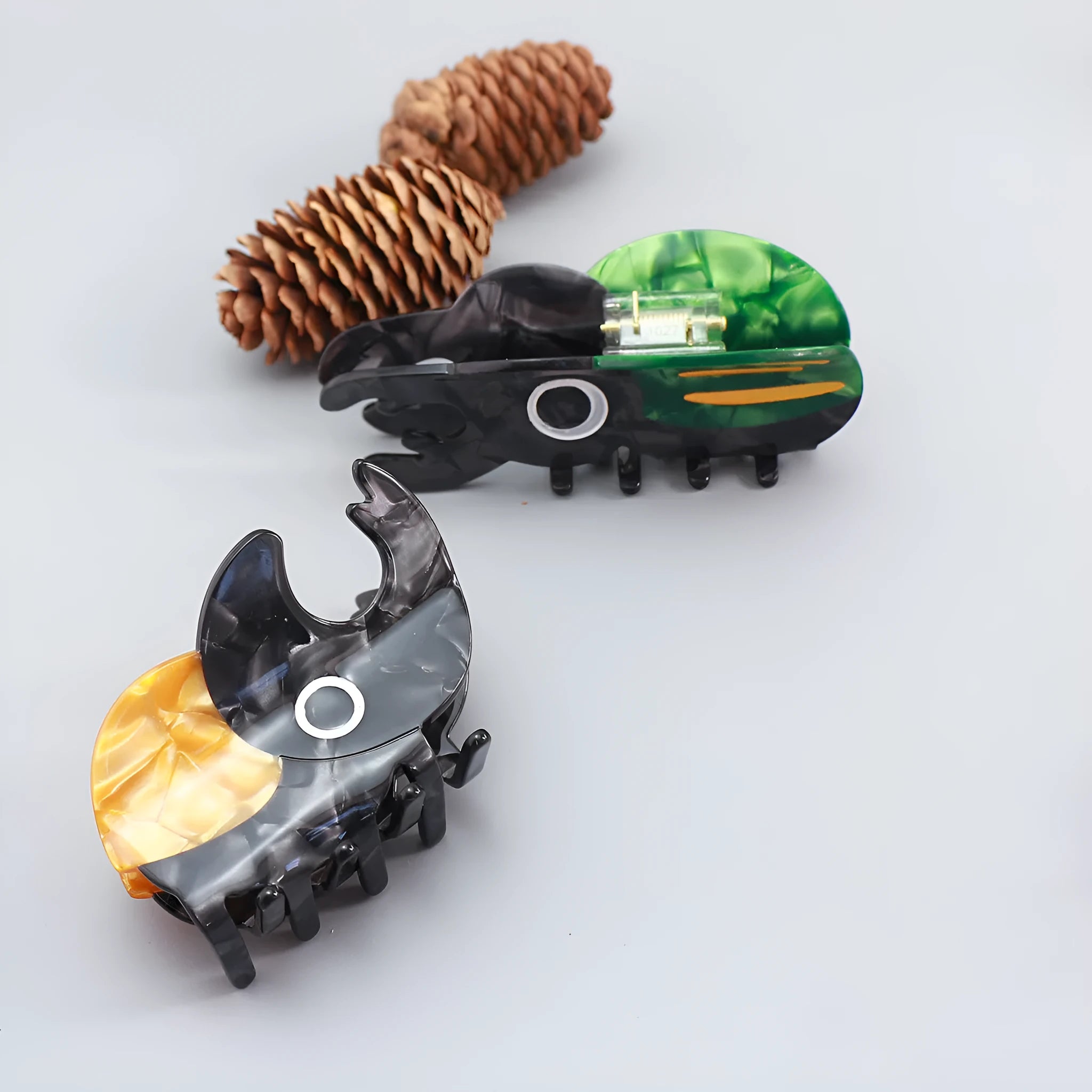 Handmade cellulose acetate hair clip with cartoon beetle design in green or orange colour options