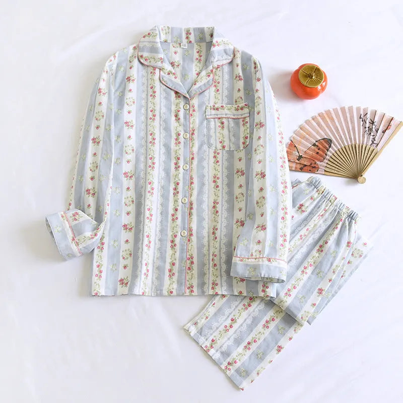 Women's striped cotton gauze long-sleeved top and matching trousers two-piece lounge set laid flat.