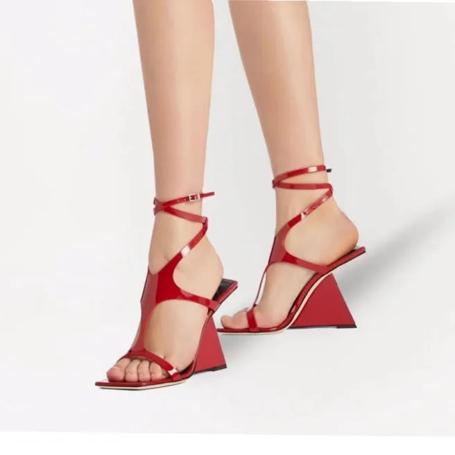 Women's black heeled sandals with a square toe and 9.5cm high heel on a white background.