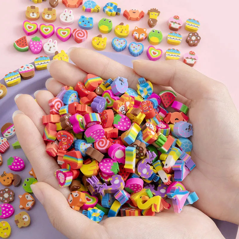 50 small colourful cartoon erasers in a pearlescent bag showing fruit, animal, cake, and Halloween themes.