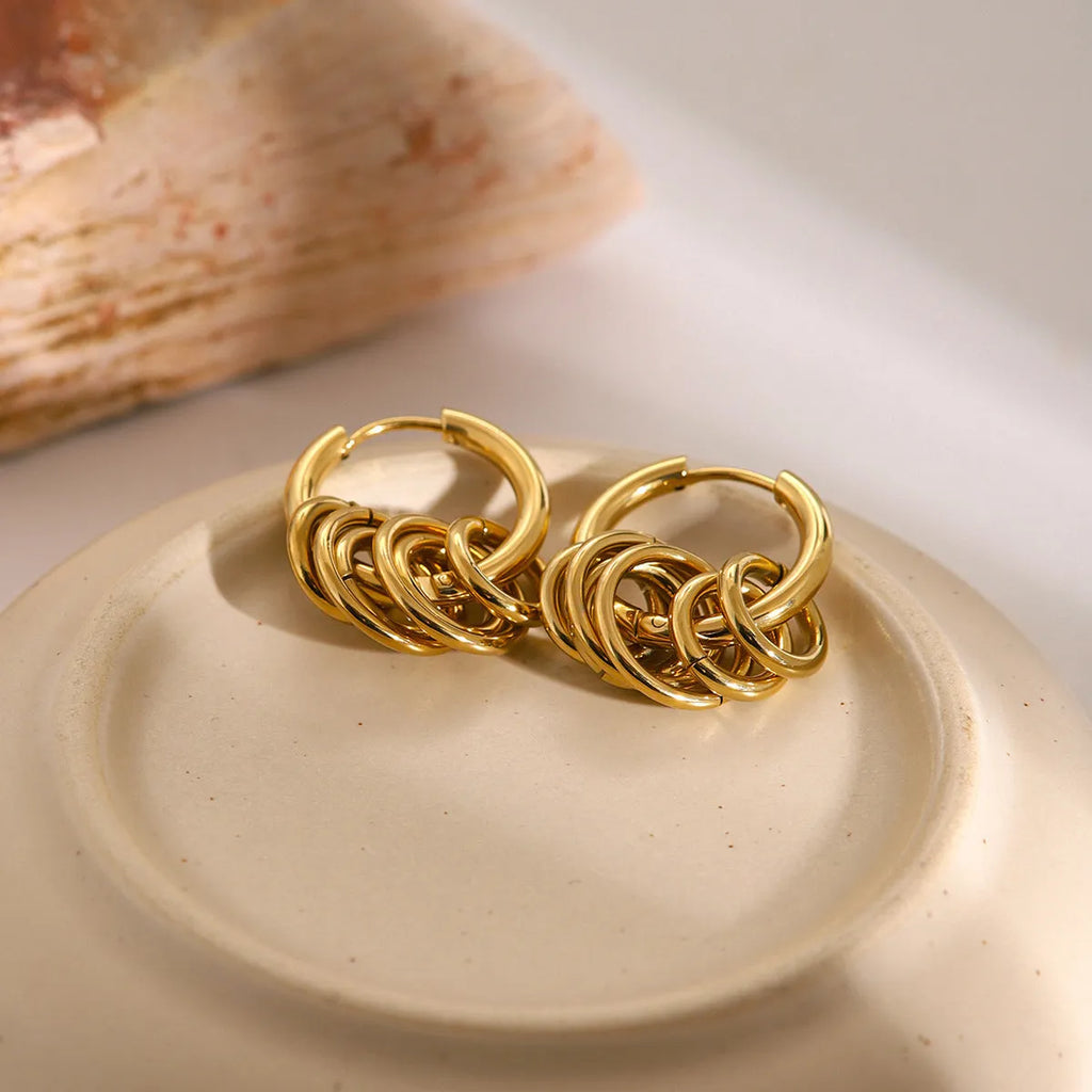 A pair of stainless steel electroplated earrings with a colour matching finish in a simple ins style.