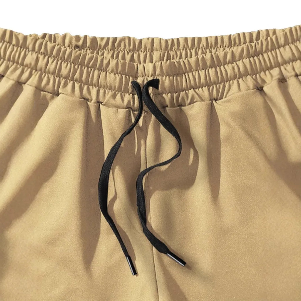 Men's khaki coconut printed sports shorts with elastic waistband and straight leg design