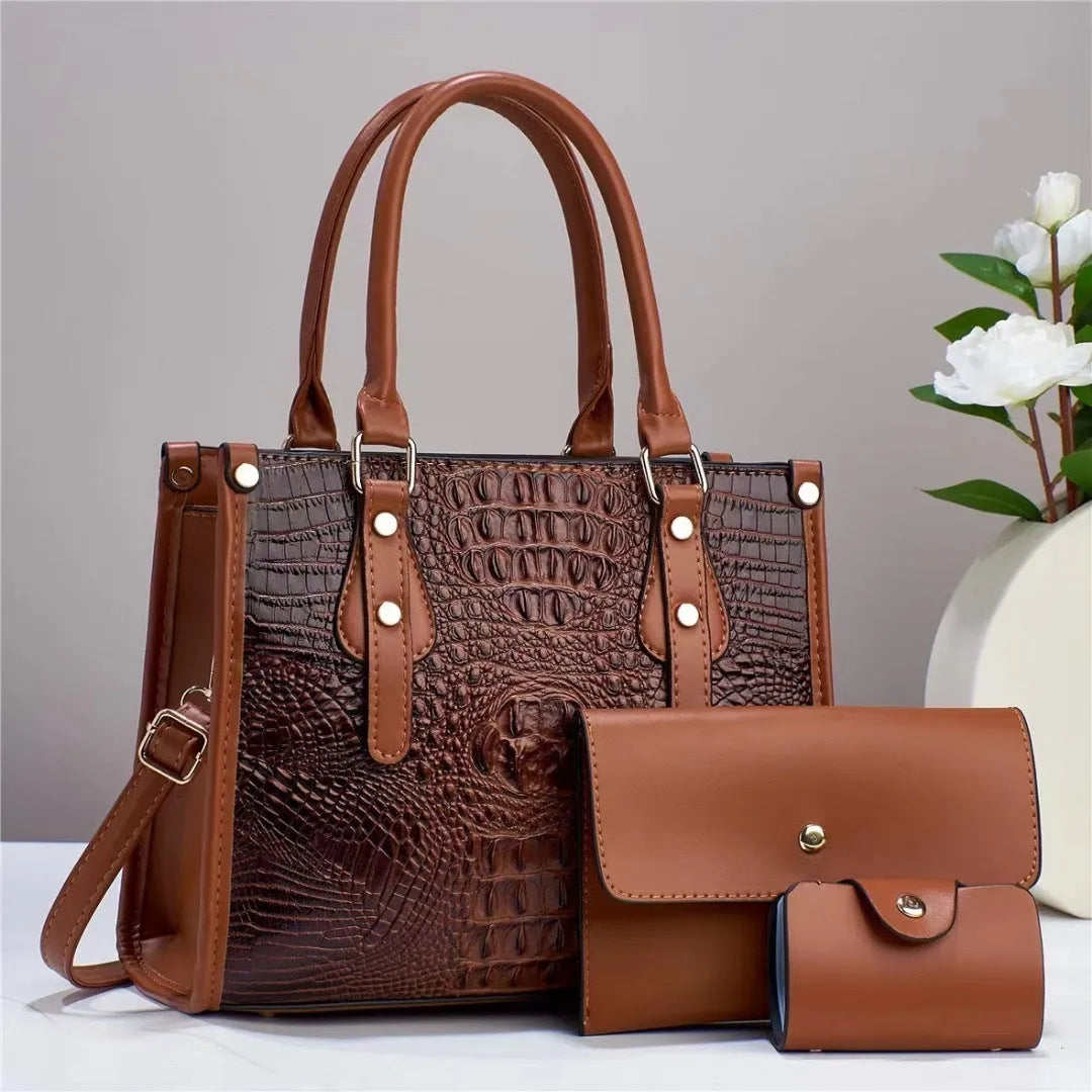 Women's burgundy PU leather bucket crossbody bag set with matching wallet and card holder.