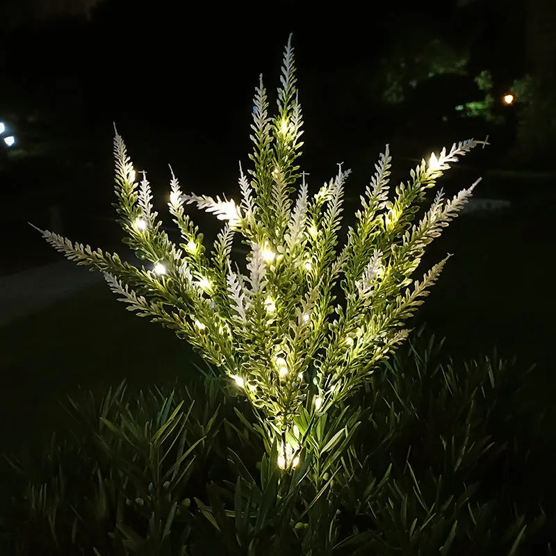 A pink flower-shaped solar LED garden light standing 74 cm tall in an outdoor setting.